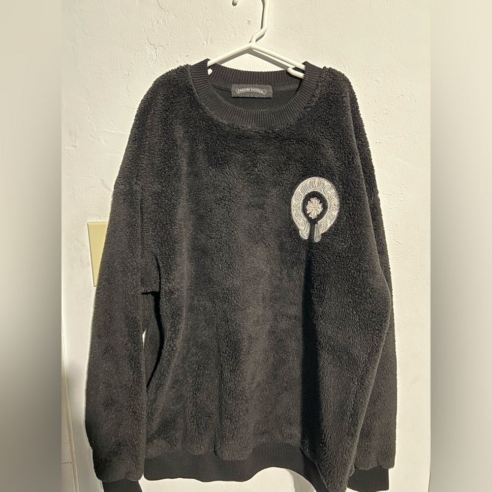 Chrome Hearts fluffy sweater.